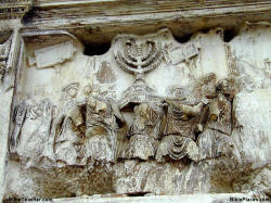Photo of relief showing menorah being taken from temple.