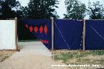 Color photo of recreation of tabernacle, view of courtyard entrance from 'Great Passion Play' copyright Elna M. Smith Foundation.