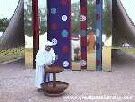 Color photo of recreation of tabernacle, front view of priest using laver in front of entrance from 'Great Passion Play' copyright Elna M. Smith Foundation.