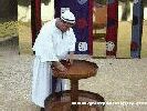 Color photo of recreation of tabernacle, view of priest using the laver of the tabernacle to wash from 'Great Passion Play' copyright Elna M. Smith Foundation.